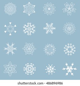 Set of beautiful different snowflakes. White ornate elements on blue background. Christmas and New year design.  