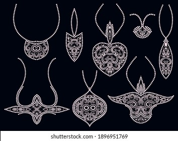 A set of beautiful pendants. White and black design for jewelry. Isolated objects on a black background. Vector clipart