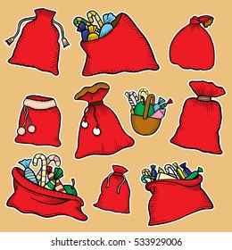 Set of beautiful red bag Santa Claus with gifts, sweets and chocolates for the kids.