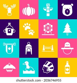 Set Beer bottle, Canadian ranger hat, Christmas tree, totem pole, Paw print, Maple syrup, Moose head with horns and Ferris wheel icon. Vector