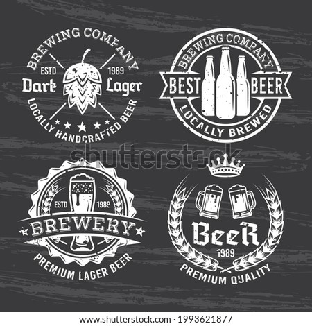 Set of for beer and brewery vector white emblems, labels and badges isolated on dark chalkboard with removable grunge texture