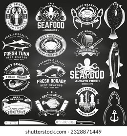 Set of best seafood badges on chalkboard. Fresh tuna, octopus, trout, shrimp, dressed crab, mussels and clams. Vector. For seafood emblem, sign, patch, shirt, menu restaurants with tuna, trout, shrimp