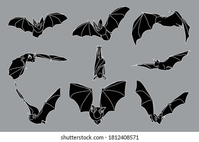 Set of black bats with white outlines for halloween and horror theme