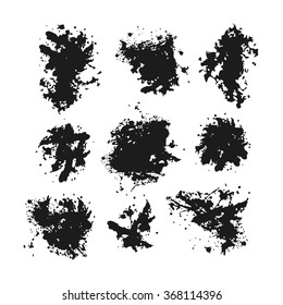Set of black blots and ink splashes isolated on white background
