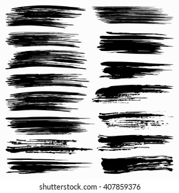 set of black brush strokes on white background