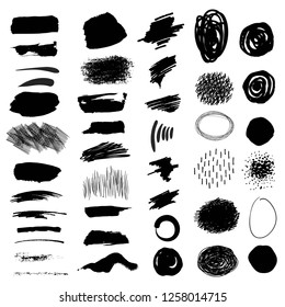 Set. Black brush strokes, spots, strokes, hatching on a white background.