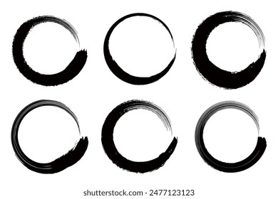 A set of black circles drawn with a brush.