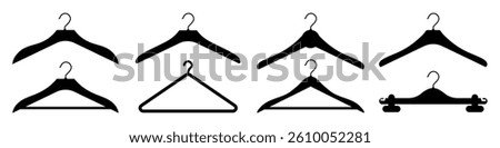 Set of black clothes hangers of different shapes. Neat arrangement in the closet. Vector isolated illustration.
