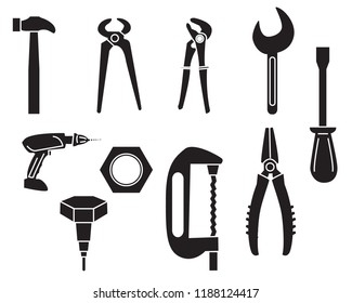 Set of black construction tools on white background.