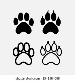 Set of black dogs paw print silhouette. Dog claw. Vector illustration. Isolated on white background.