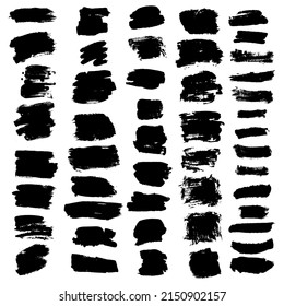 set of black grunge spots and brush strokes of different shapes isolated on white in vector