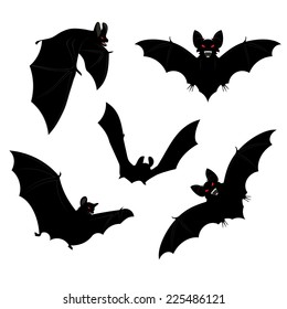 Set of black halloween bats silhouettes with red eyes.