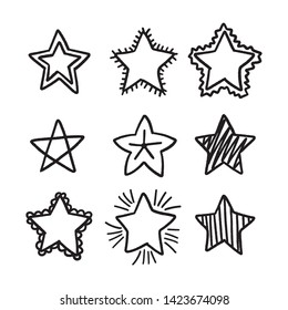 Set of black hand drawn doodle stars in isolated on white background.