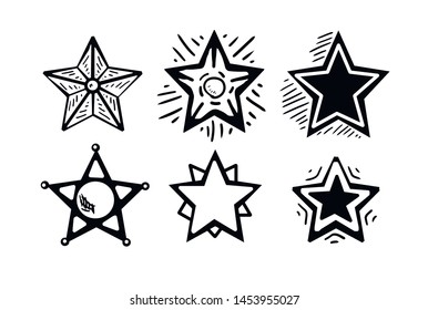Set of black hand drawn doodle stars. star icon on white background. vector illustration