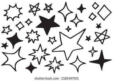 Set of black hand drawn doodle stars in isolated on white background.