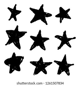 Set of black hand drawn vector stars in doodle style on white background. Could be used as pattern or standalone element. Brush marker sketchy