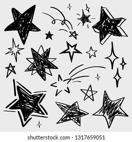 Set of black hand drawn vector stars in doodle style isolated on white background. Could be used as pattern element, cards, childish design