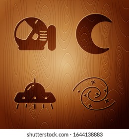 Set Black hole, Astronaut helmet, UFO flying spaceship and Moon and stars on wooden background. Vector