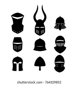 Set of black icons of knightly helmets. Isolated silhouette of medieval warrior hat. Vector illustration
