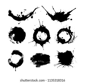 Set of black ink splashes and drops made with brush. Blobs and spatters. Isolated vector illustration