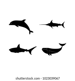 Set of black isolated contour silhouettes of cachalot, shark, unicorn-fish, dolphin. Icons collection of ocean animals
