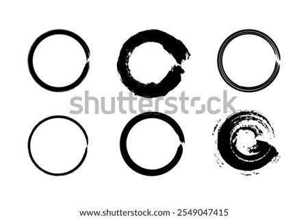 Set of black paint circle brush strokes representing the Zen enso from Japanese calligraphy. Features rough borders and grainy chalk texture.