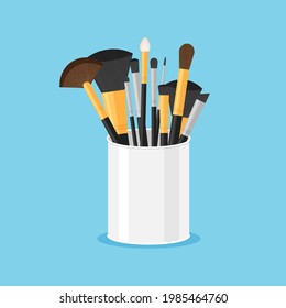 Set of black pure professional brushes for makeup in a glass. Make up artist kit. Angle, fan and flat brush. Vector illustration isolated on blue background.
