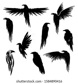 Set of black ravens silhouettes. Black birds. Vector illustration isolated on a white background.