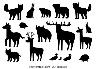 Set of black silhouette forest animals. Cartoon isolated vector fox, wolf, bear, bear cub, elk, deer, fallow deer, hedgehog, hare, duck, duckling, lynx, horse, wild boar