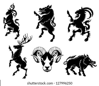 Set of black silhouette on horned animal heraldry element