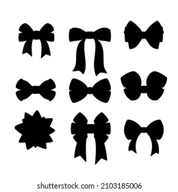 A set of black silhouettes of bows on a white background.
