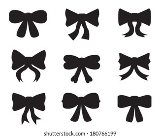 Set of black silhouettes of different bows on white background