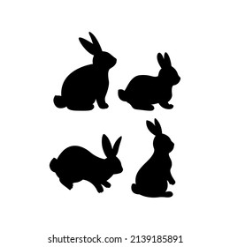 Set of black silhouettes of Easter bunnies. Cute hand drawn vector illustration. Isolated white background. For Easter decor, scrapbooks, invitations and cards