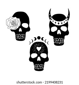 Set of black silhouettes of mystical skulls with heart, moon phases and rose flower. Hand drawn boho illustrations