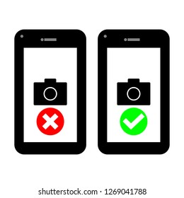  set of black smartphones with x cross and check mark symbol and camera on white screen; photography and video recording permission sign concept