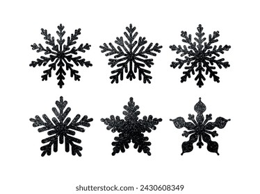 Set of black snowflakes in glitter of dark. Collection of decorative elements for the Christmas holiday. Vector illustration