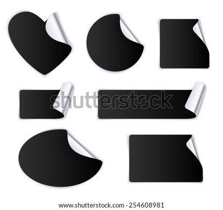 Set of black stickers - silver foil reverse side. Peeled off paper labels. Heart, circle, square, oval.