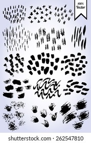 Set of black vector ink brush strokes isolated. Paint brush work on textured paper.