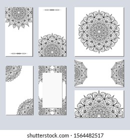 Set of black and white cards with the image of a circular mandala. Vector