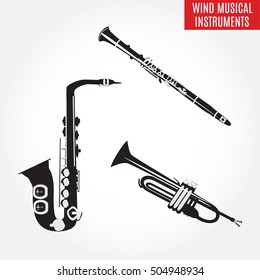 Set of black and white classical wind musical instruments. Vector illustration of saxophone, clarinet and trumpet isolated on white background. Woodwind and brass musical instruments.