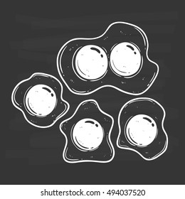 set of black and white delicious fried eggs using doodle art on chalkboard background