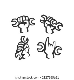 set of black and white hands holding wrench vector illustration