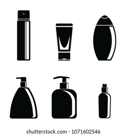 Set of black and white jars with cosmetics on a white background