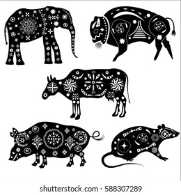 Set of black and white silhouettes of animals with patterns. Ornament applied to the elephant, buffalo, rat, cow, pig in the style of ancient Indian tribal and aboriginal ethnic styles.