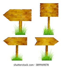 Set of blank wooden pointers directions in green grass