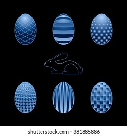 A set of blue easter eggs with decoration and rabbit on a black background
