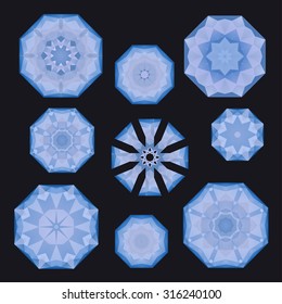 Set of blue polygonal snowflakes on almost black, in vector