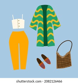 A set of boho outfits and various boho elements. Fashionable clothes, bag, top, trousers, jacket, shoes.