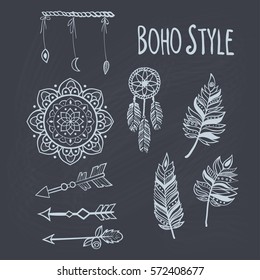 A set of Boho style hand drawn elements: dreamcatcher, feathers, mandala,arrows - isolated on chalkboard.