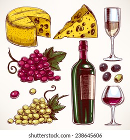 set with a bottle and glasses of wine, bunch of grapes and cheese